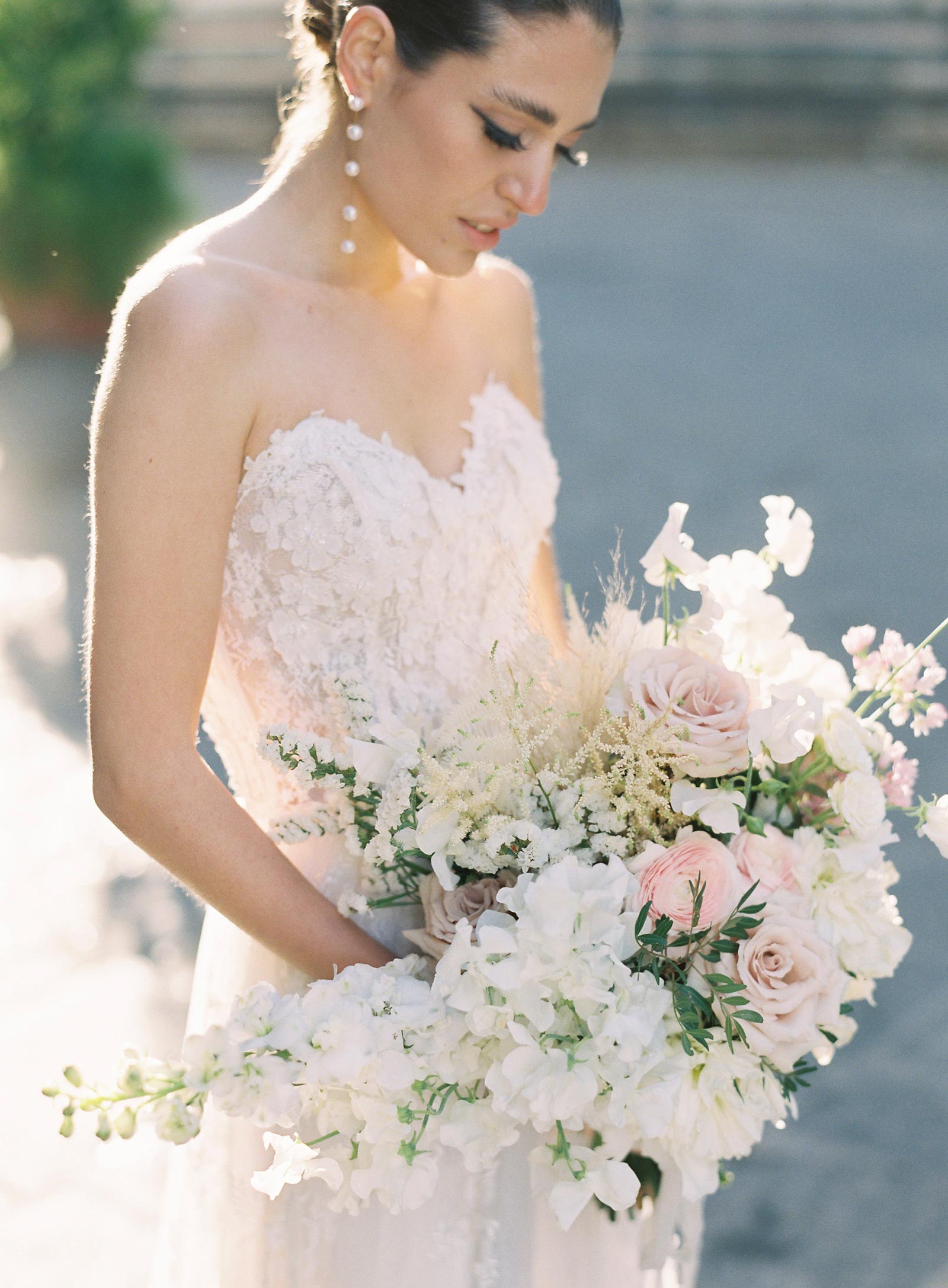 Bride with wedding bouquet in Anais Corset Wedding Dress