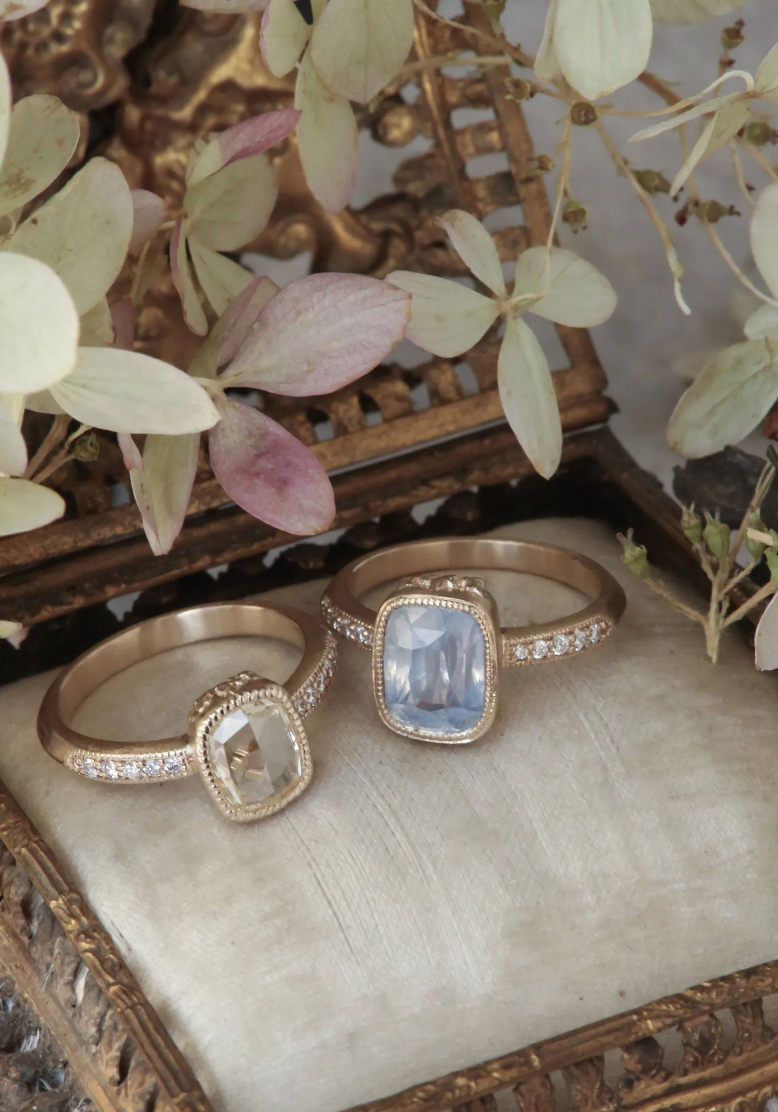 The Aurelie ring with the Chamomile Ring on a jewelry box.