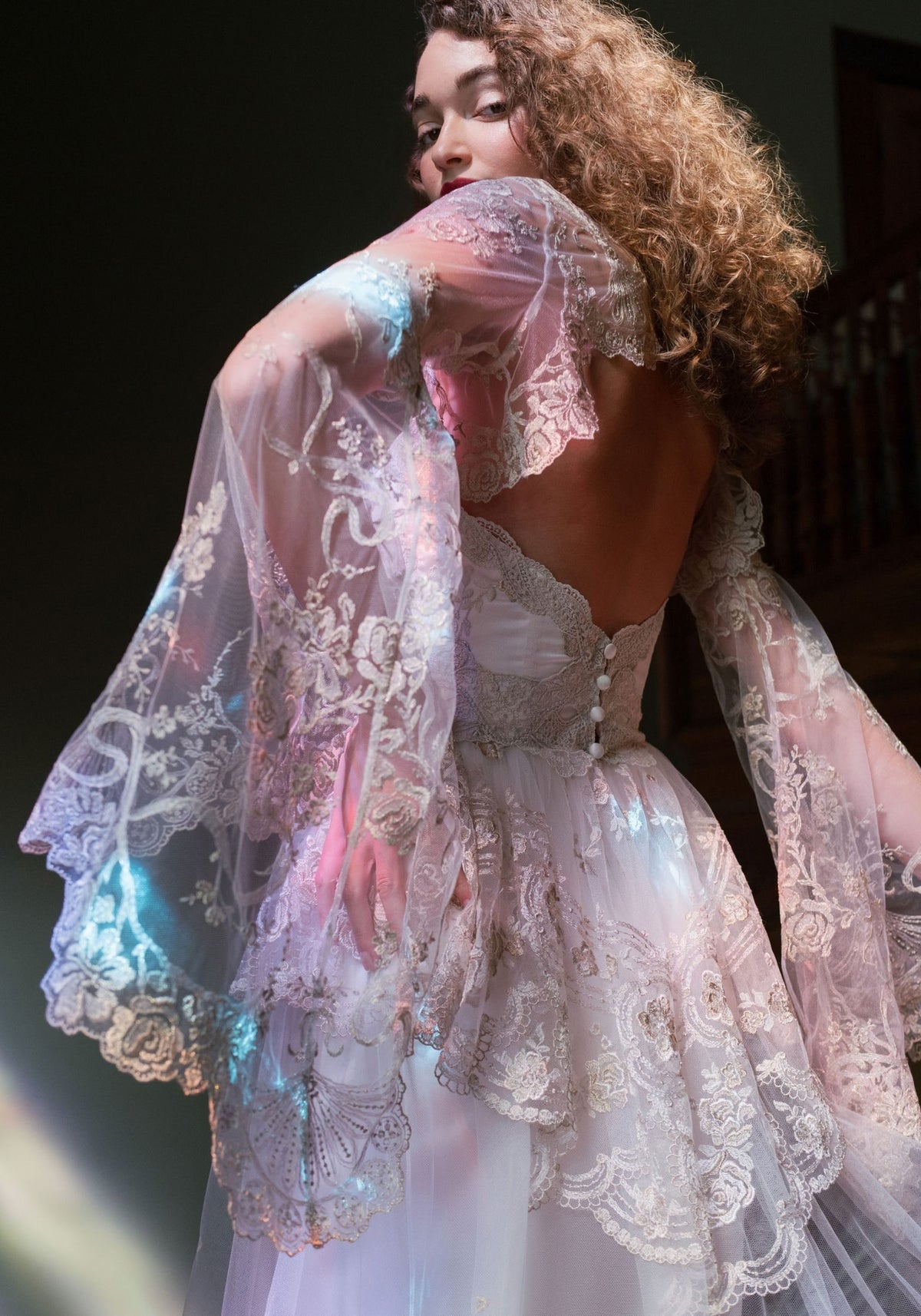 Open back of the Filigree Bolero with cascading embroidered bell sleeves