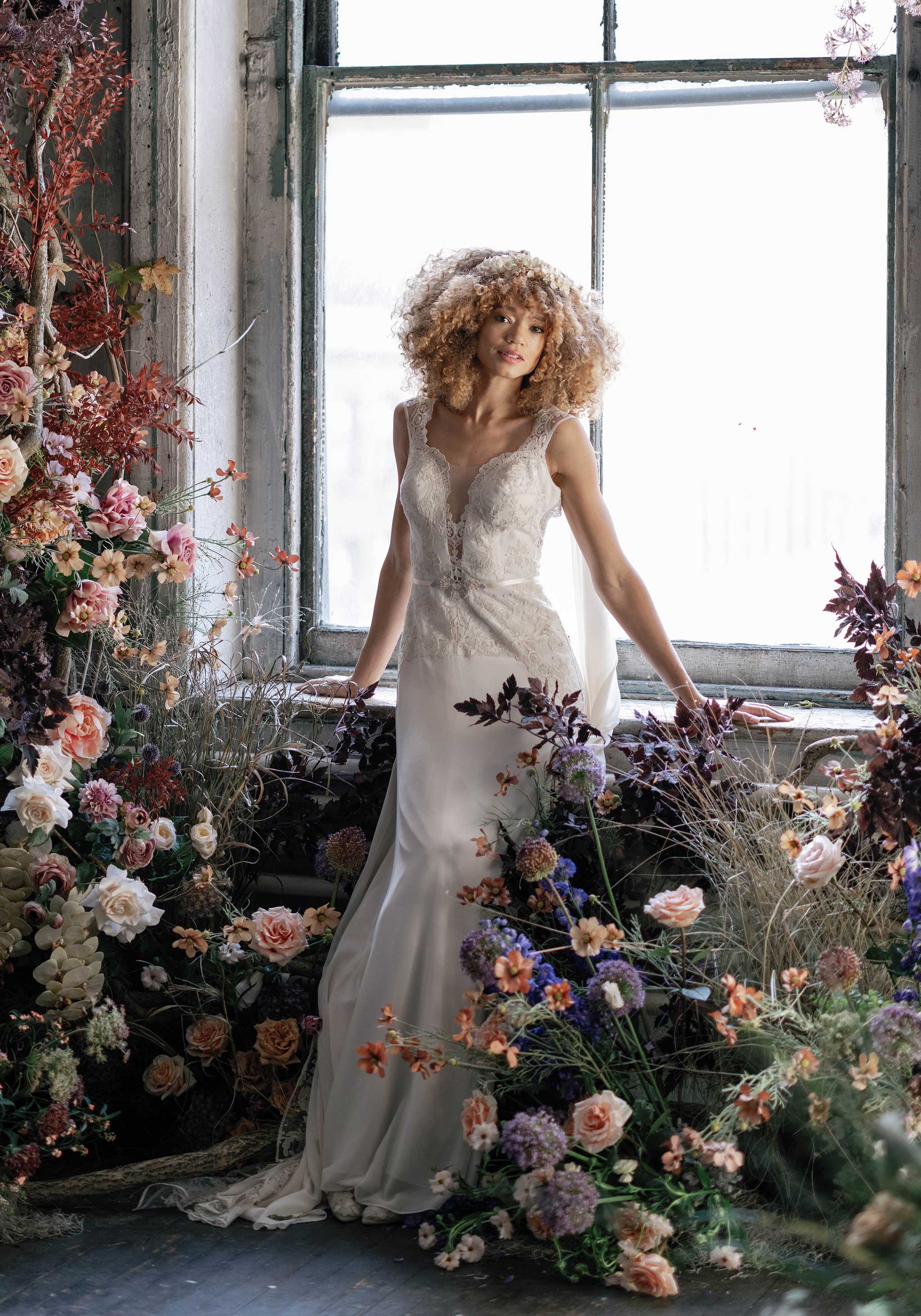 Model in wedding dress with floral decorations