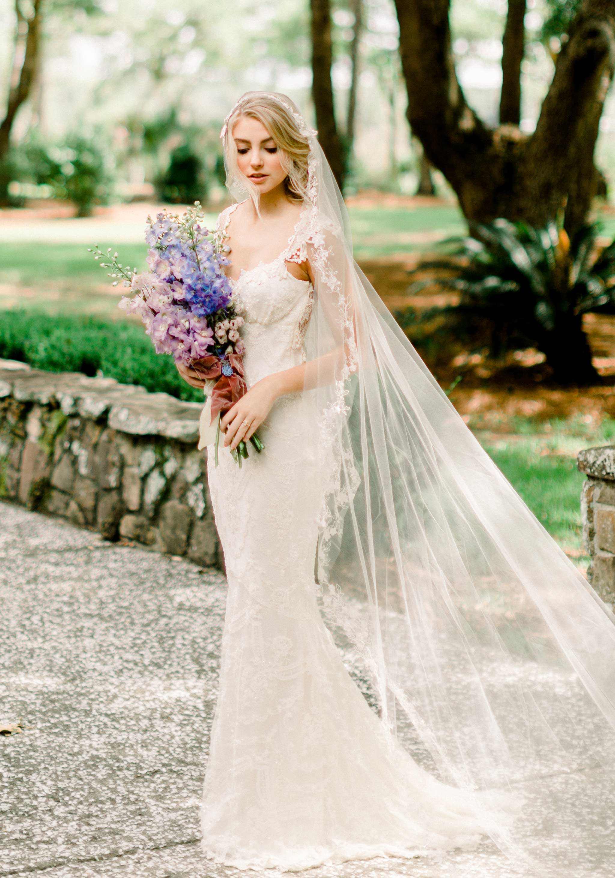 Fit and flare mermaid body style wedding dress by Claire Pettibone