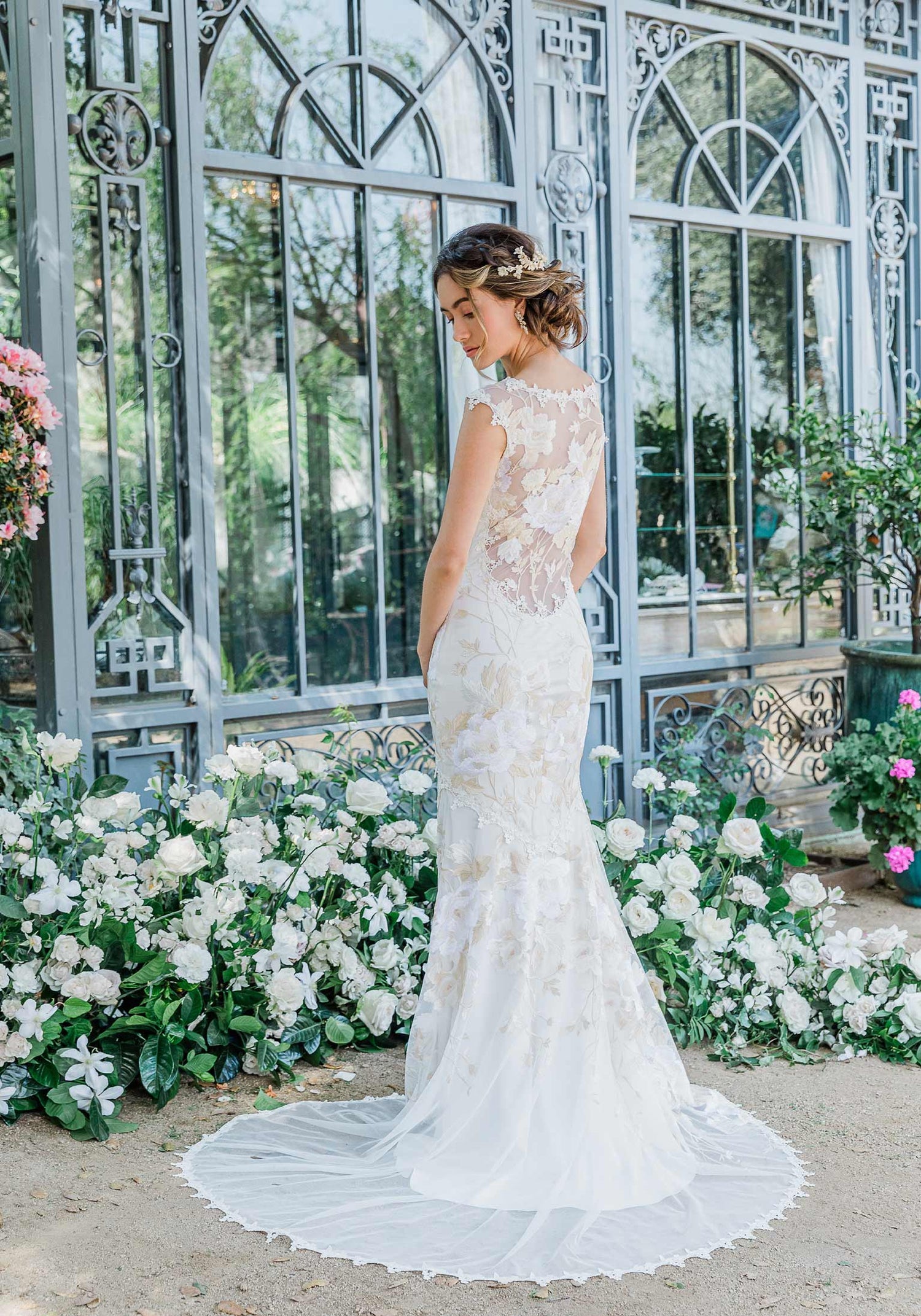 Floral  lace and embroidered wedding dress designed by Claire Pettibone