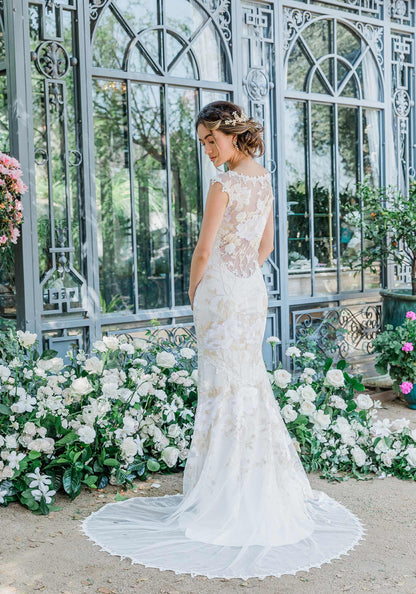 Floral  lace and embroidered wedding dress designed by Claire Pettibone