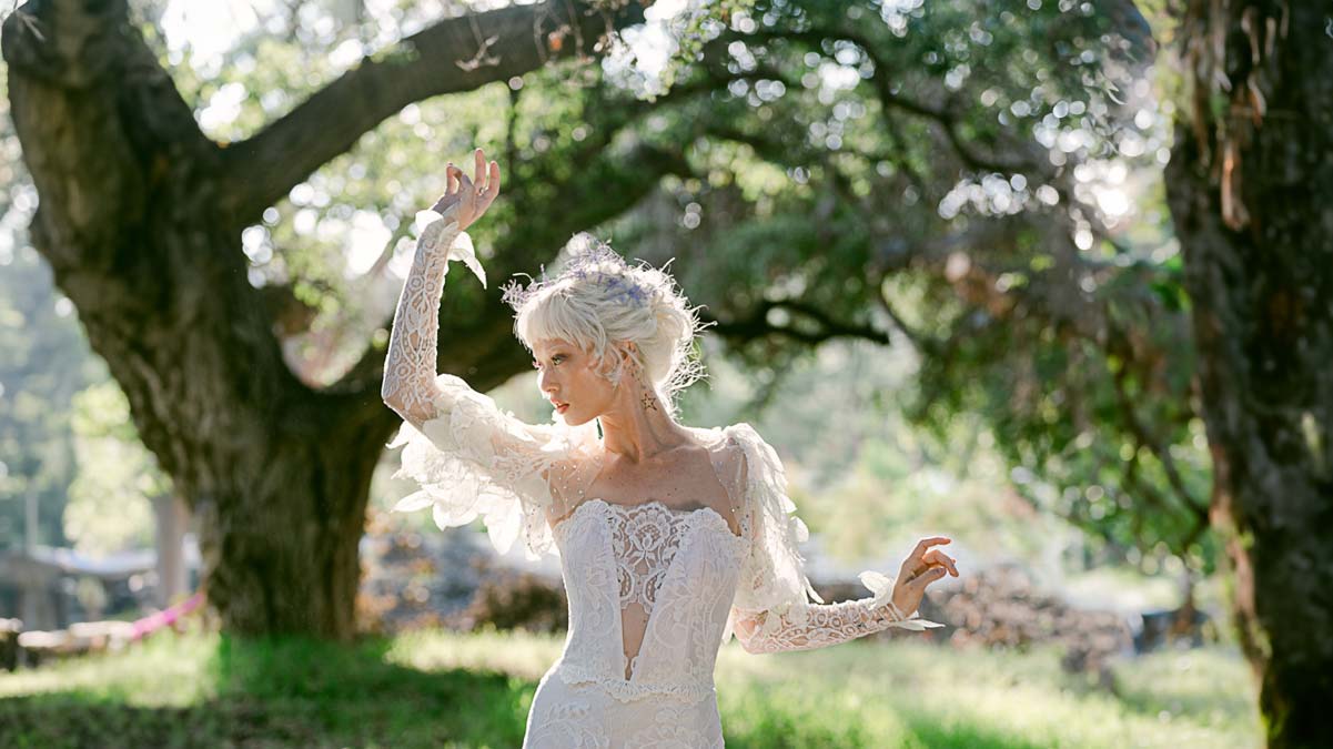 Model in Quill Wedding Dress Moonlight Reverie Collection designed by Claire Pettibone