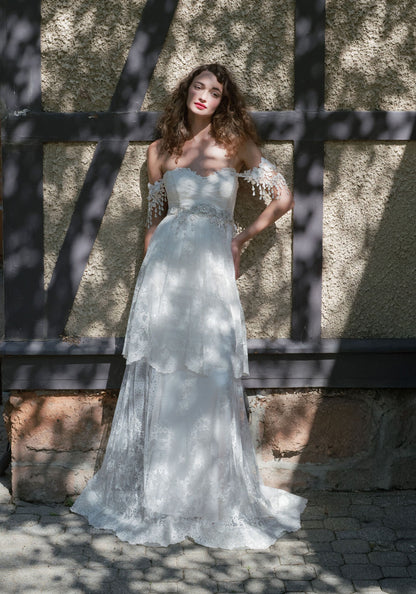 Bride in the Amourette tiered lace wedding dress in dappled sunlight at the Rhine House, Beringer Vineyards