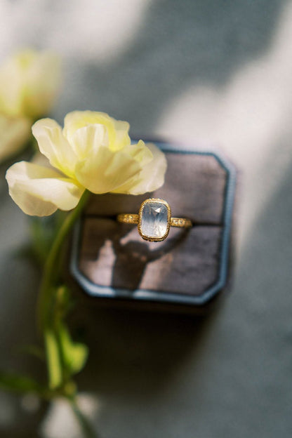 Blue sapphire ring in ring box by the North Way Studio in Collaboration with Claire Pettibone. 