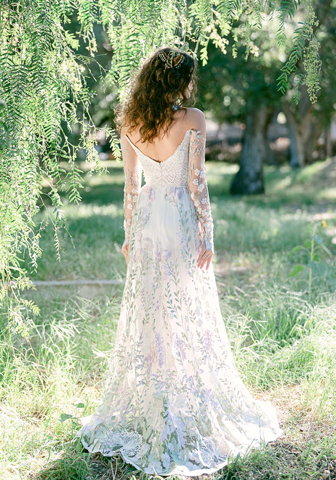 Colorful wedding dress Meadowsweet in romantic forest field.