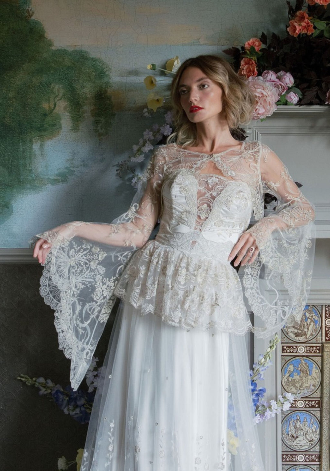 Filigree embroidered tulle bolero with bell sleeves worn over the Primrose gown by Claire Pettibone