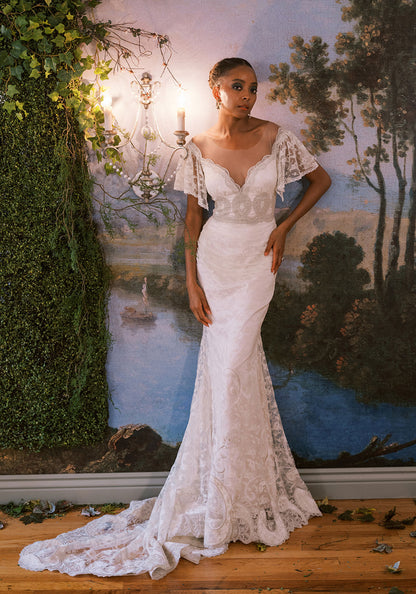 Front view of Claire Pettibone Laurel wedding dress with lace, flutter sleeves, and fitted bodice