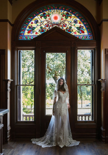 Narcisse wedding dress before the stained glass doors of the Rhine House, Beringer Vineyards