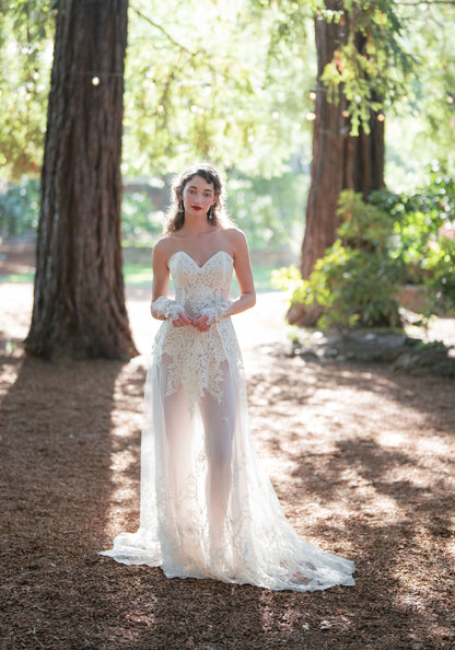 Narcisse lace wedding dress with sheer chiffon skirt in a sunlit redwood grove