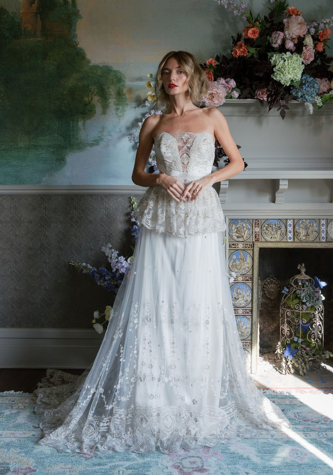 Primrose strapless corset wedding dress with antique gold French embroidery and layered peplum by Claire Pettibone