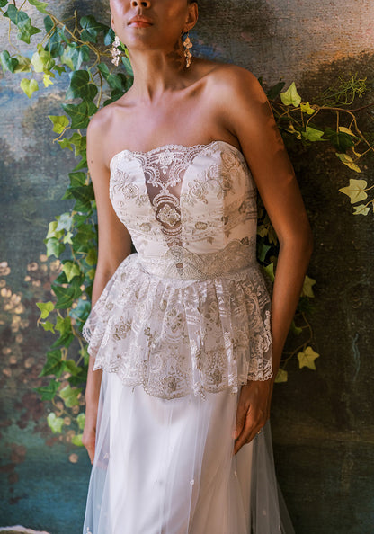 Primrose gown by Claire Pettibone featuring gold lace and peplum bodice