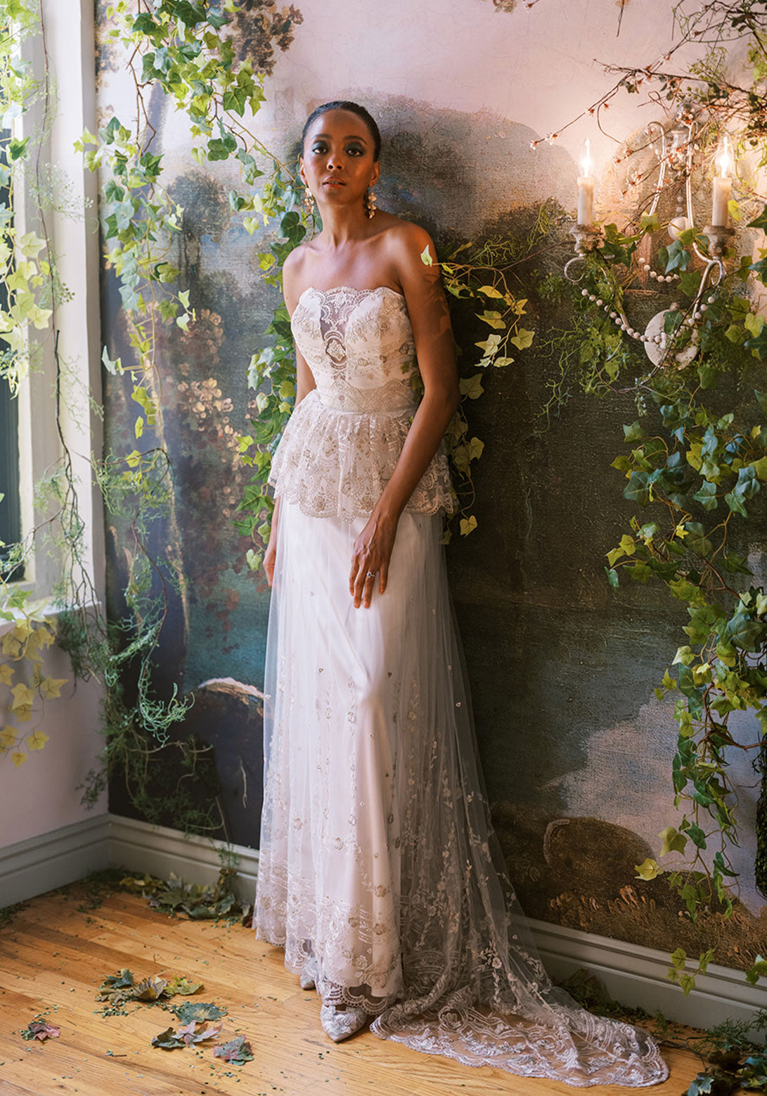 Front view of Claire Pettibone Primrose dress with structured bodice and floral embroidery.