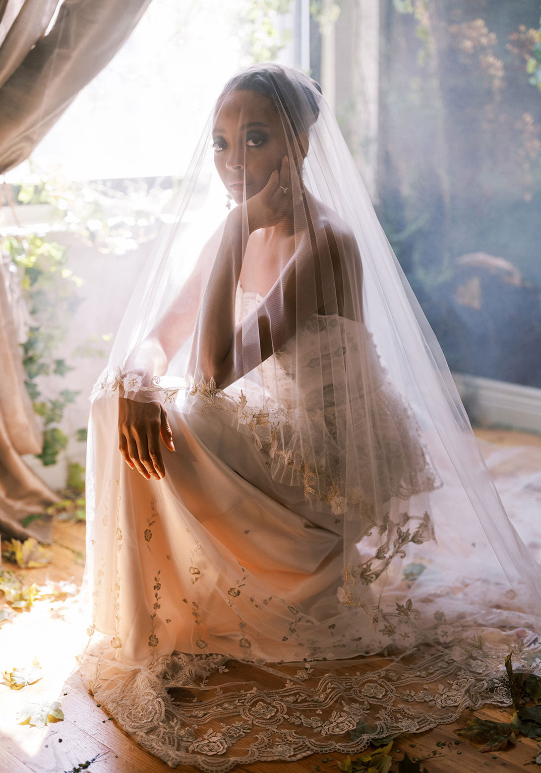 Claire Pettibone Primrose gown, featuring a lace peplum and floral beading on the bodice.