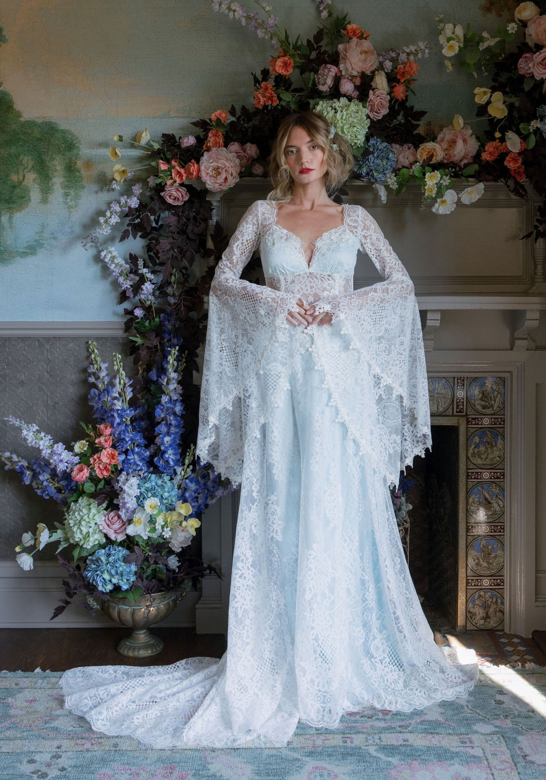 Front view of the Serenade lace wedding dress with plunging sweetheart neckline and sheer basque waist