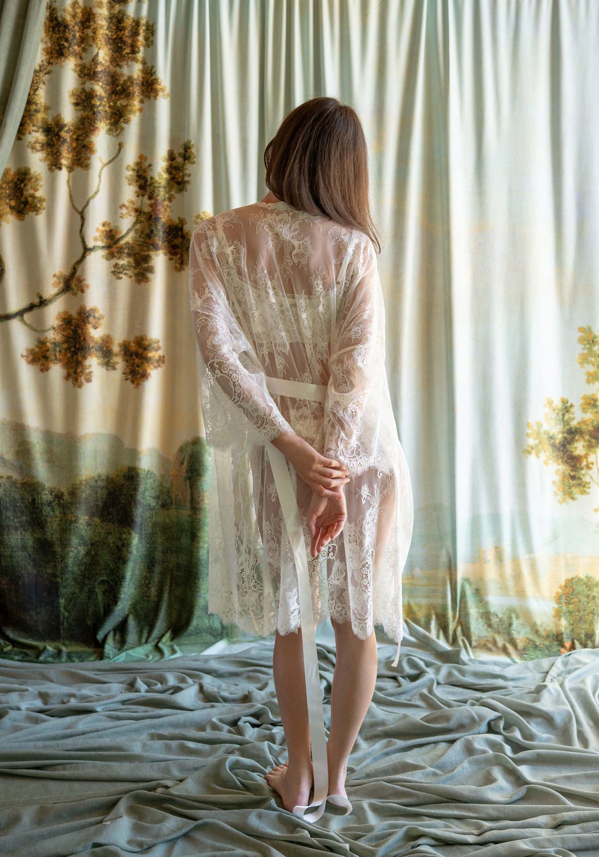 Full-length ivory floral Leavers lace bridal kimono robe with long bell sleeves and silk sash.