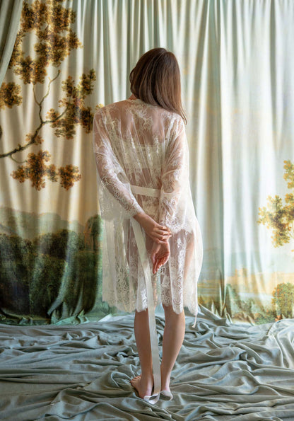 Full-length ivory floral Leavers lace bridal kimono robe with long bell sleeves and silk sash.