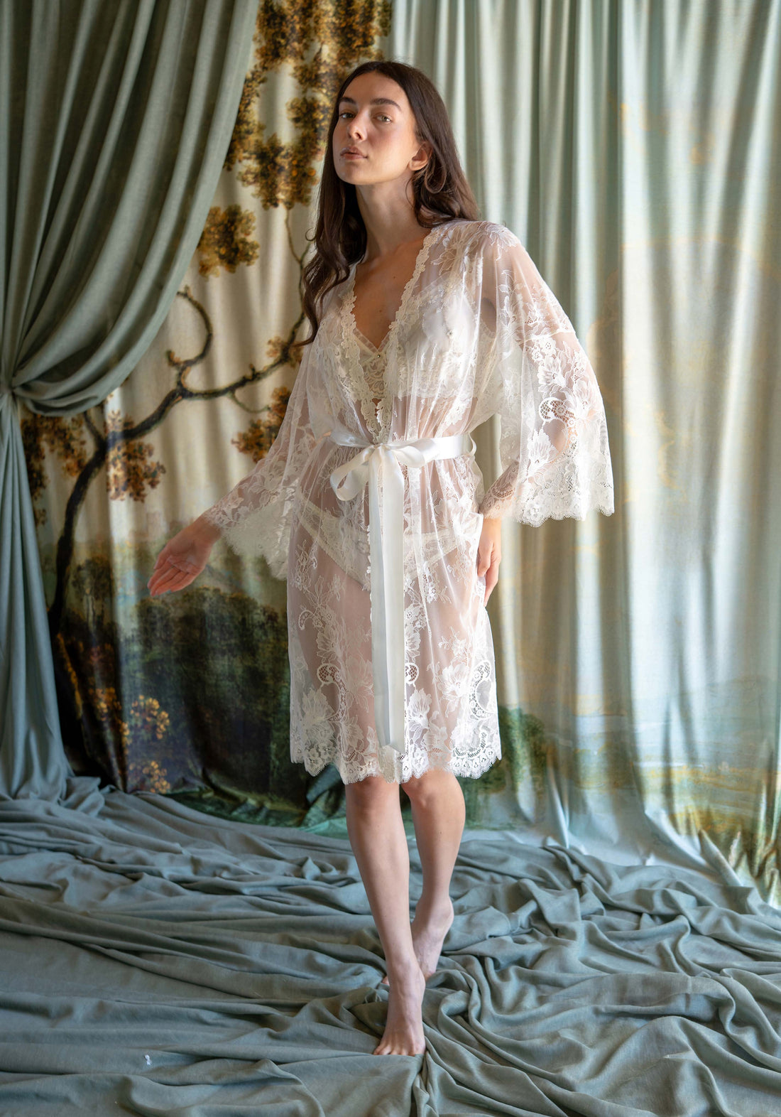 Full-length ivory floral Leavers lace bridal kimono robe with long bell sleeves and silk sash.