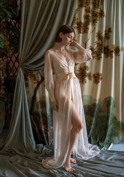 Sheer tulle boudoir robe with champagne floral embroidery and ivory lace inlays on a model.