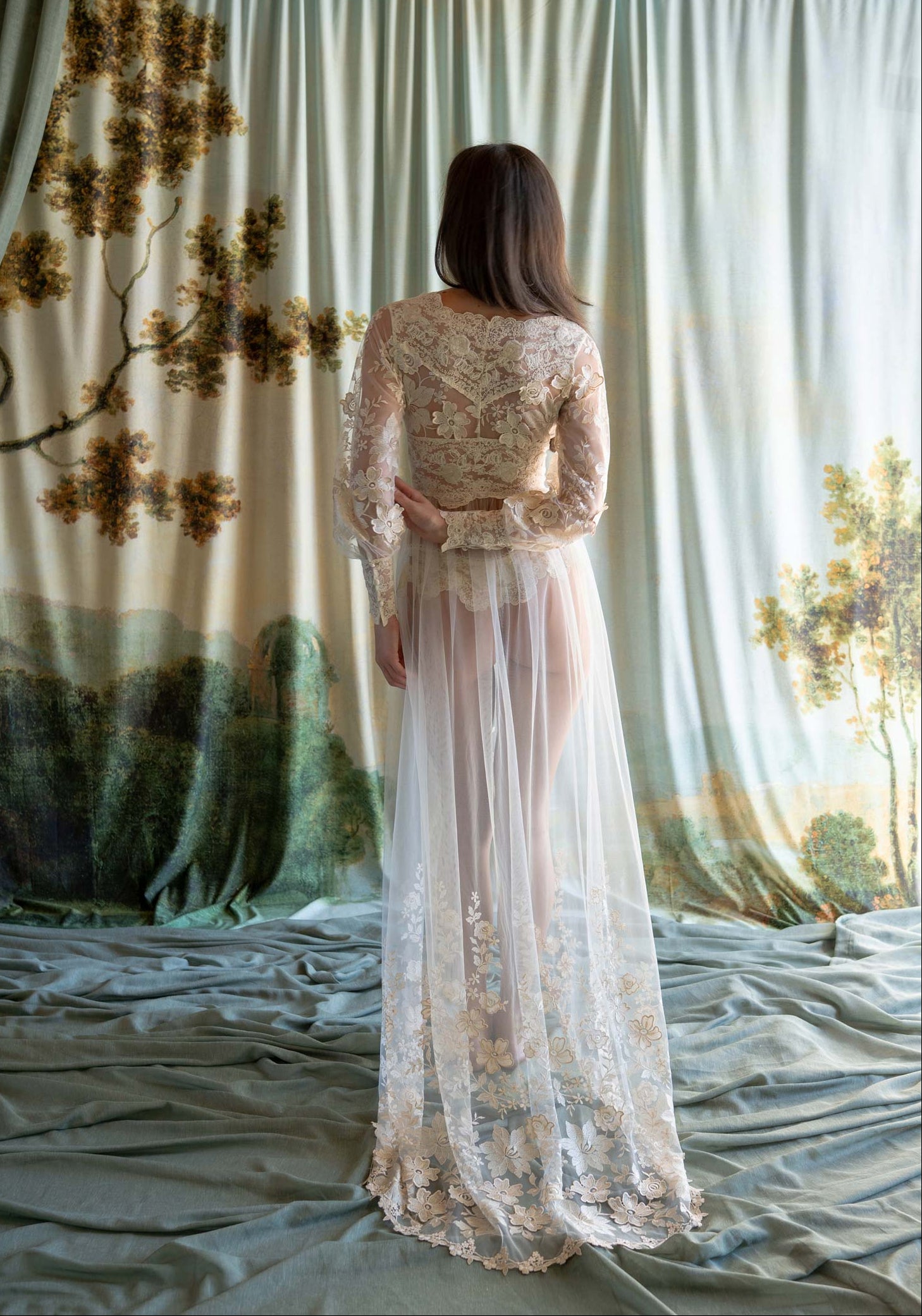 Sheer tulle boudoir robe featuring ecru floral embroidery and an intricate lace-inlaid bodice.
