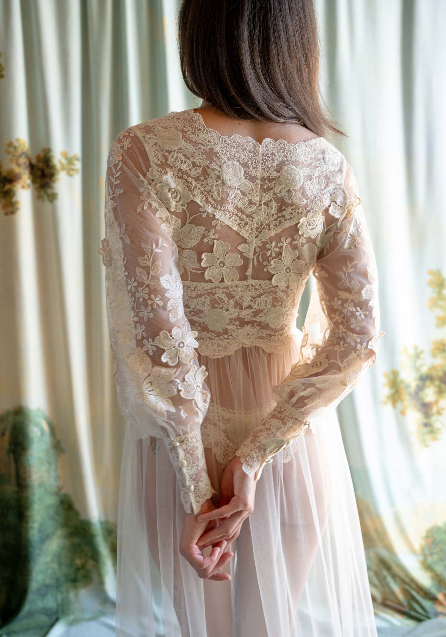 Sheer tulle boudoir robe featuring ecru floral embroidery and an intricate lace-inlaid bodice.