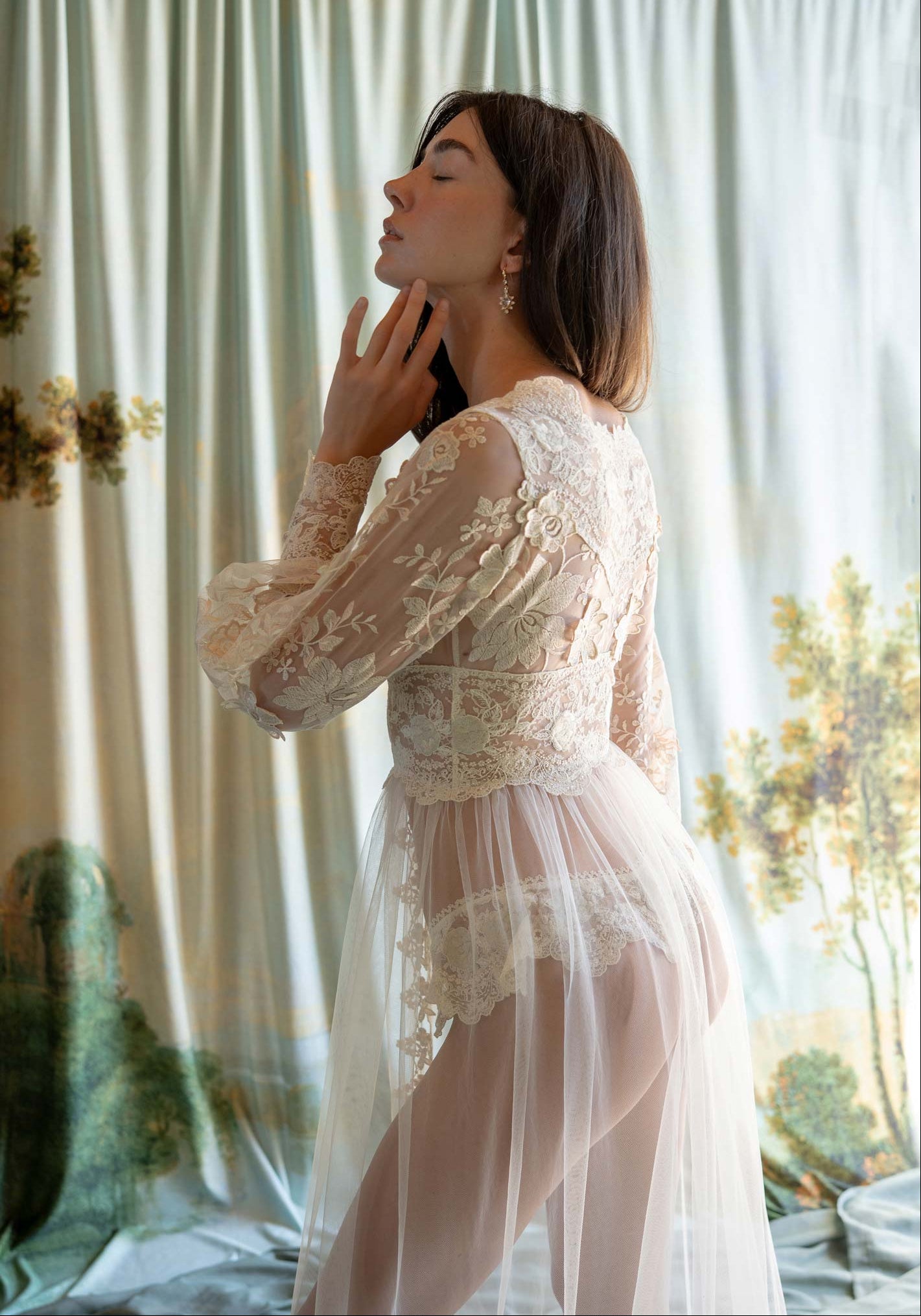 Sheer tulle boudoir robe featuring ecru floral embroidery and an intricate lace-inlaid bodice.