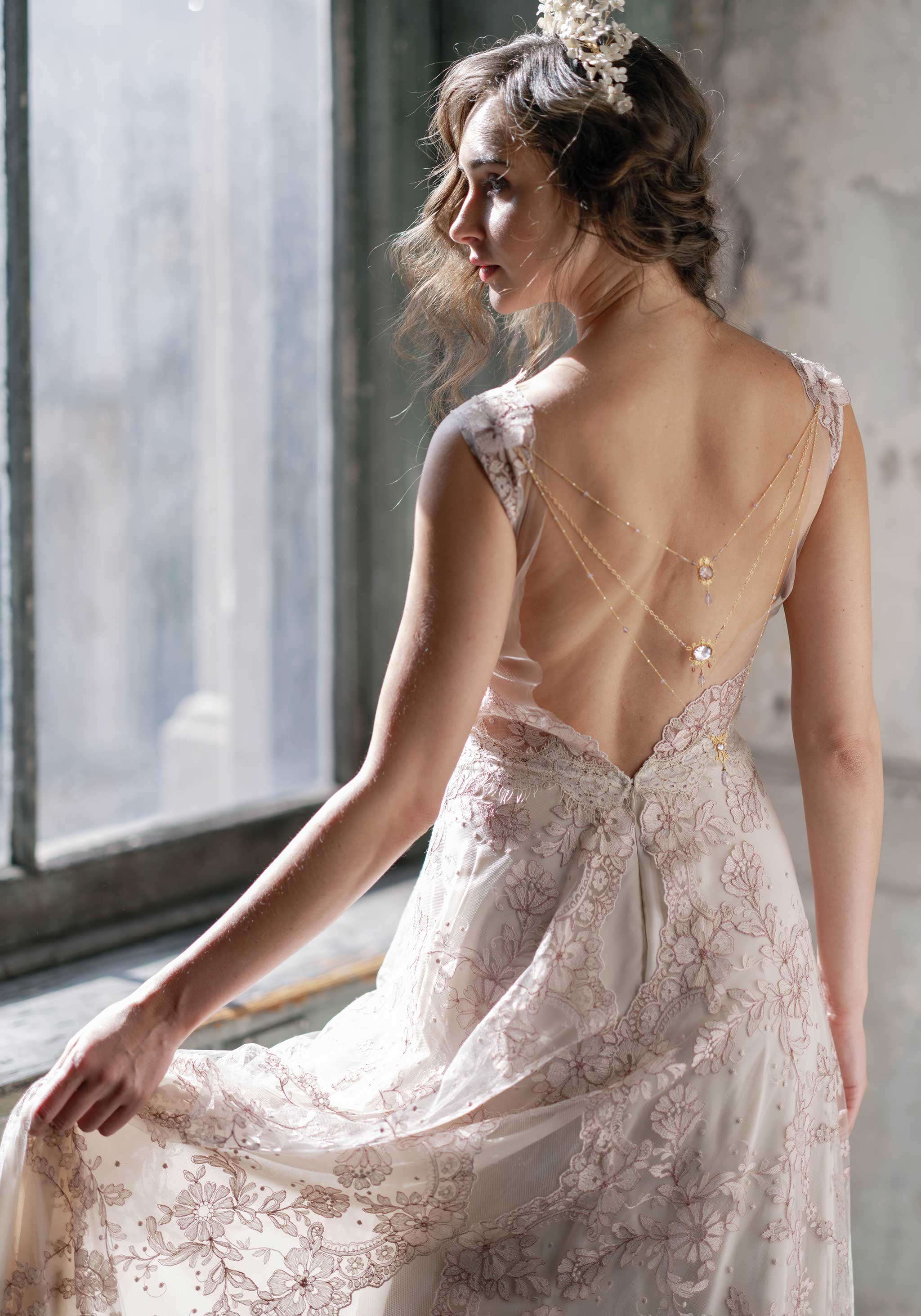 Open Back bridal gown with adorned bridal accessory