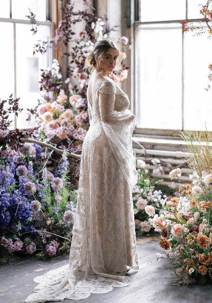 Filigree designer wedding dress with flowing long sleeves