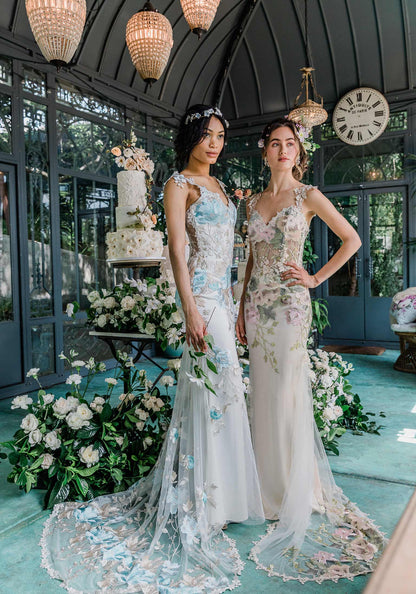 Models in Claire Pettibone Designed wedding Dresses with wedding cake and floral arrangements