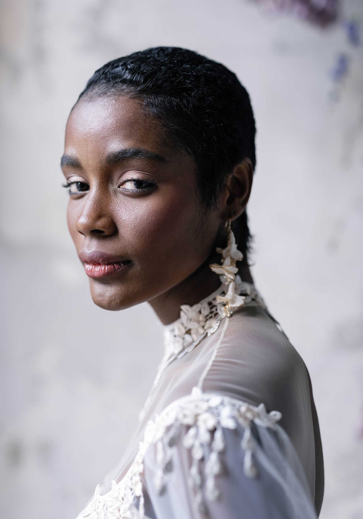 Model wearing designer silk wedding dress Riviere by Claire Pettibone