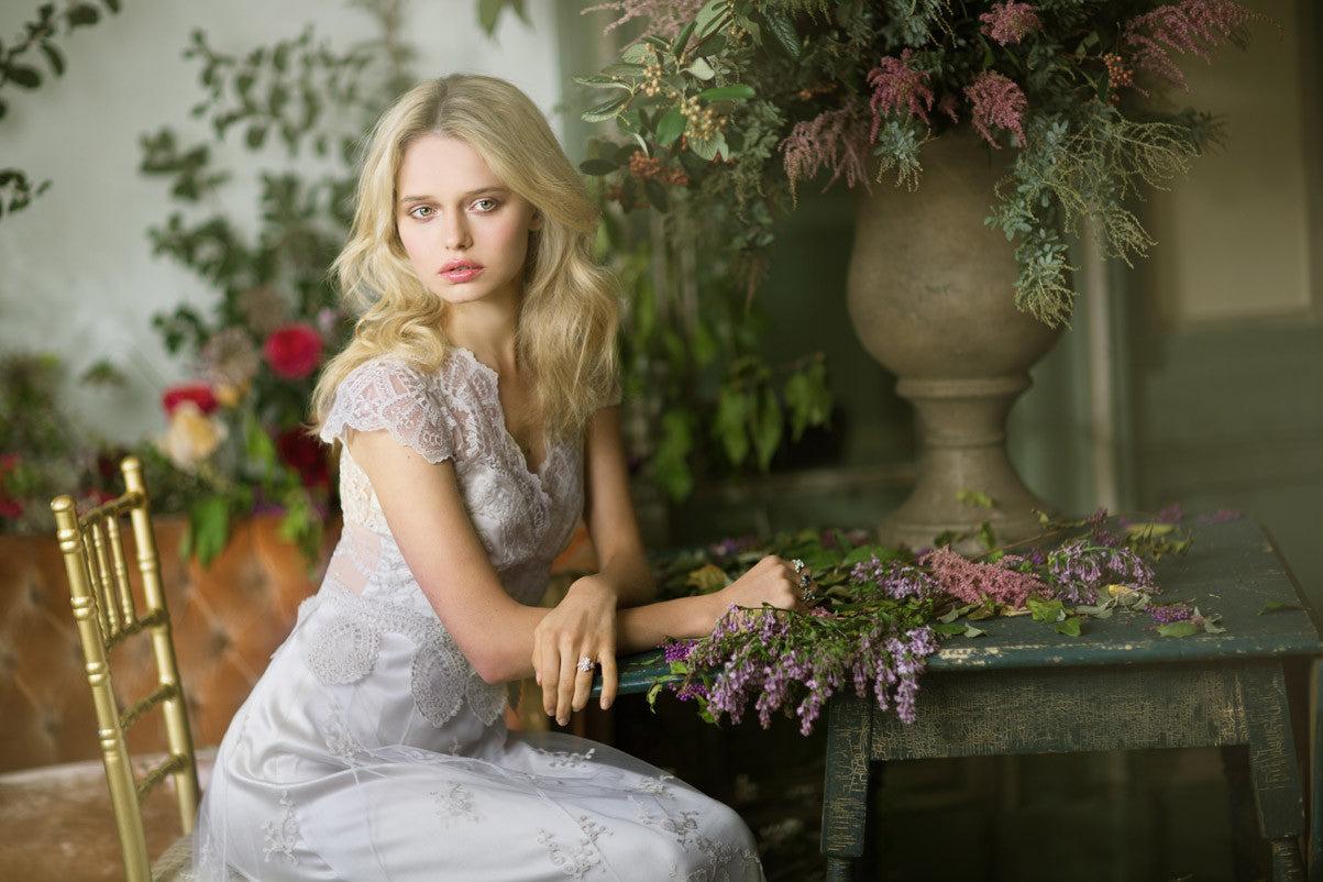 Cora - Couture Wedding Dress by Claire Pettibone campaign image seated close